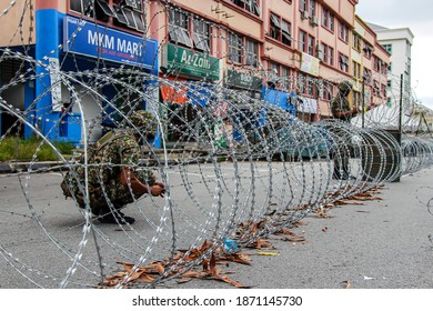 Members Of Malaysian Armed Forces Are Open The Barbed Wire Following Enhanced Movement Control Order In Nilai, Negeri Sembilan, Malaysia On December 1, 2020