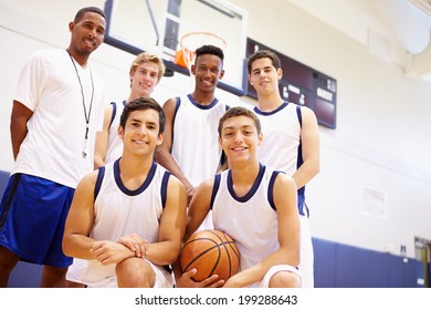 Members Of Male High School Basketball Team With Coach