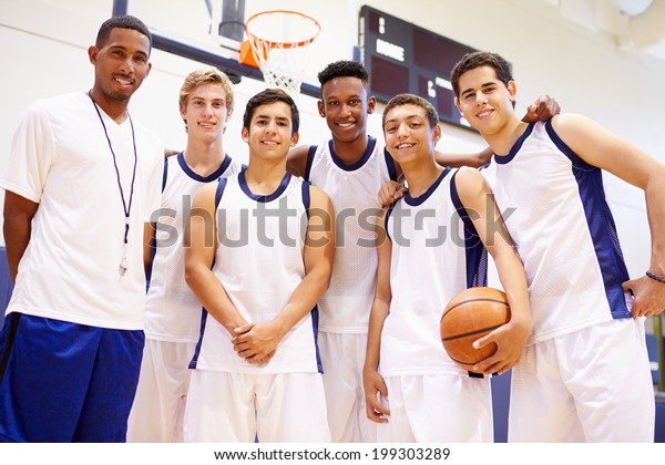 Members Of\
Male High School Basketball Team With\
Coach