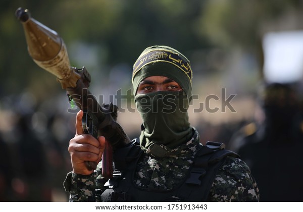Members of the Palestinian Islamic Jihad militant\
group take part in a military parade during a condolences ceremony\
for the movement\'s former leader Ramadan Shalah in the Gaza Strip,\
on June 8, 2020.