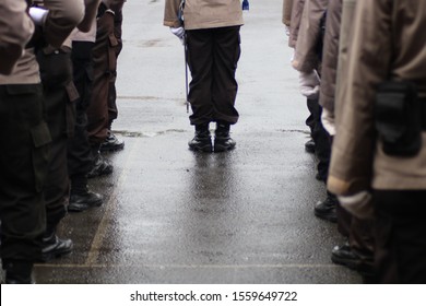 Members Of The Police Force Wear Uniforms And Line Up Neatly