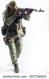 Members of the Special Forces unit. Russian Special Operations fighter with AK-74 assault rifle
aiming a machine gun on a white background