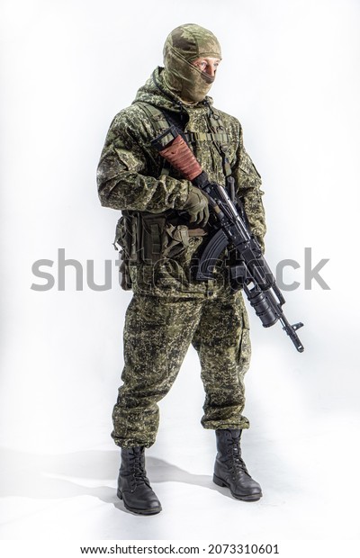 Members of the special purpose unit. A Russian\
special forces soldier stands with an AK-74 assault rifle on a\
white background