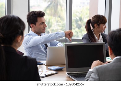 Members Who Attended The Meeting Did Not Agree With The Project Summary, Businessman Showing A Disagreement With Thumb Down At The Conference Table In The Office Of Company, Disagree Briefing Concept