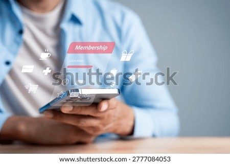Membership loyalty rewards program and customer exclusive benefit. Man using smartphone app for shopping discount, points collection and lifestyle privilege.