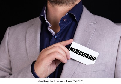 MEMBERSHIP text is written on the card that the businessman puts in his jacket pocket. Business concept.