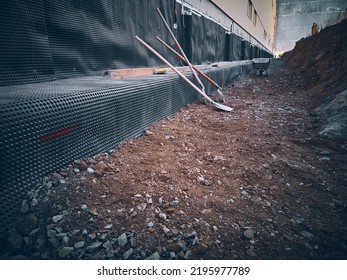 Membrane Waterproofing. Bitumen Membrane Water Proofing Of Industrial Building. Backfilling Earthworks. Showels In A Trench