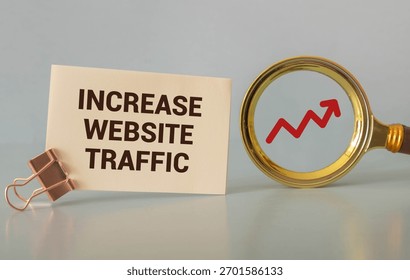Memo note written with text WEBSITE TRAFFIC isolated on green background
