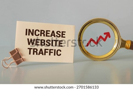 Memo note written with text WEBSITE TRAFFIC isolated on green background