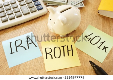 Memo sticks with words IRA 401k ROTH. Retirement plans.
