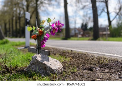 Memorial Cross With Flowers At The Scene Of An Accident At The Roadside