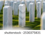 Memorial Day concept. Sarasota National Cemetery with rows of white tomb stones on green grass