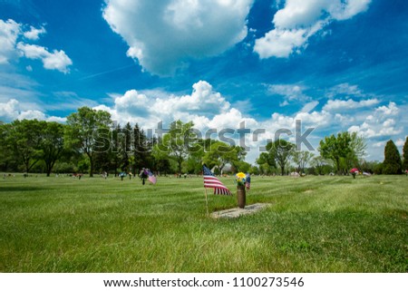 Memorial Day tributes to veterans at a cemetary