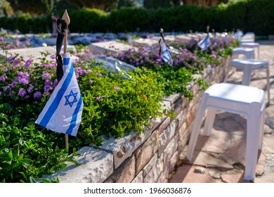 Memorial flag with Yizkor (In memory) word on a soldiers grave on Memorial Day for the Fallen Soldiers of Israel and Victims of Terrorism.