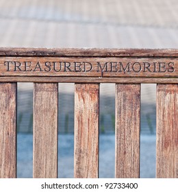 A Memorial Inscription On A Bench At The Marina.