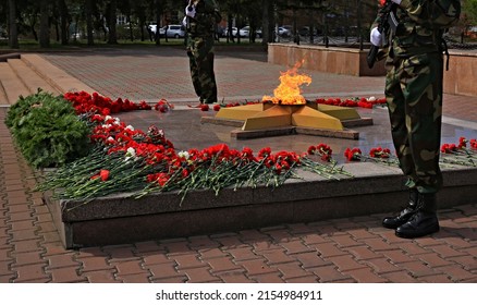 Memorial To The Unknown Soldier Of The Russian Army With An Eternal Flame, Flowers, Guard Of Honor