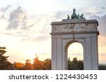 The Memory Arch (Arco de la Vitoria), built by fascist francoist regime, in Moncloa, Madrid, during a summer sunset