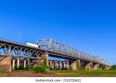  The Memphis Arkansas Memorial Bridge on Interstate 55 crossing the Mississippi River between West Memphis, Arkansas and Memphis, Tennessee.with the Frisco Bridge and Harahan Bridge in the background