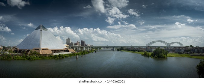 MEMPHIS, TENNESSEE - JUNE 28 2019: Panoramic View Of The Bass Pro Shops At The Memphis Pyramid, Downtown Memphis, The Wolf Creek Harbor, And The Hernando DeSoto Bridge, From The AW Willis Ave Bridge.