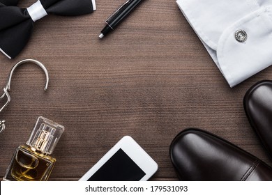 men accessories on the brown wooden table - Powered by Shutterstock