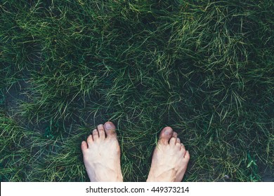 Men Bare Feet On Grass
