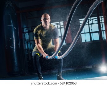 Men With Battle Rope Battle Ropes Exercise In The Fitness Gym. CrossFit.