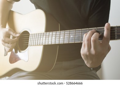 Men Black Shirt Playing Acoustic Guitar Cord Em Closeup With Sunlight