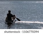 Men are boating in the river
