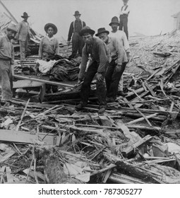 Men Carrying Bodies On Stretcher, Surrounded By Wreckage Of The Hurricane In Galveston, Texas, Sept. 1900. The Disaster Occurred On Sept. 8th, But Relief Efforts Took Two Days To Get Underway And Took