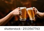 Men clinking mugs with beer during celebration of Oktoberfest outdoors party background.Cheers with beer and enjoy tradition.