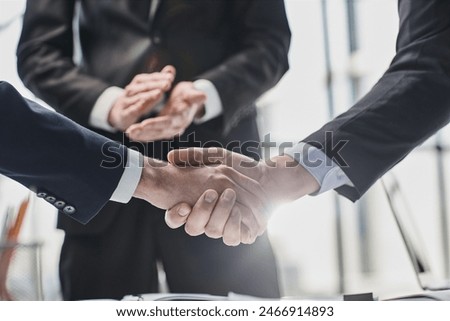 men close-up, looking in a folder with documents