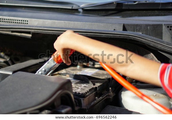 Men are conducting car check routines before travel\
- engine oil check
