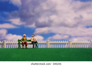 Men Conversing On Bench