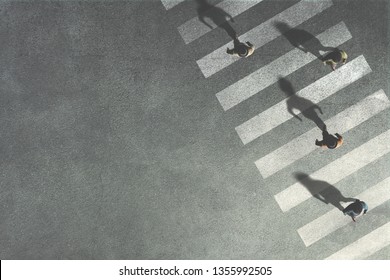 Men Crossing The Street At Crossroads