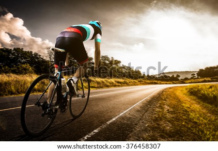  Men cycling road bike in the morning