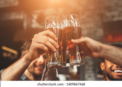 Men Drinking Draft Beer And Clinking Glasses At Pub, Closeup - Shutterstock ID 1409867468