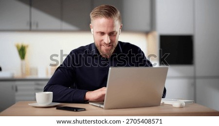 Men Engaging In Virtual Training Session On Laptop In Kitchen