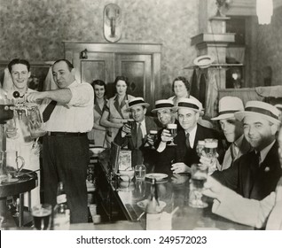 Men enjoying 3.2% beer on the 4th of July in Bangor, Maine, 1933. - Shutterstock ID 249572023