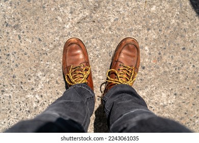 Men fashion in leather boots, Close up view on man's legs in black jeans and brown leather boots, Toned picture. - Powered by Shutterstock