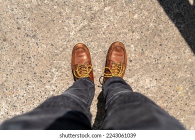 Men fashion in leather boots, Close up view on man's legs in black jeans and brown leather boots, Toned picture. - Powered by Shutterstock