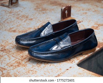 Men Fashion Leather Loafer Shoe On The Steel Floor.