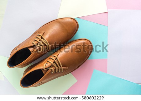 men fashion shoe on color paper background