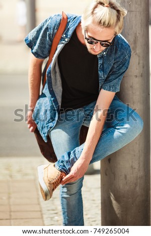 Similar – black haired man posing with sunglasses