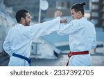 Men, fight and punch in karate class, training and speed with sparring partner, workout and morning for development. Martial arts team, contest and fitness with mma exercise, coaching or sports