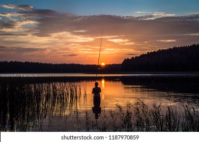 Men Fishing In Sunset.