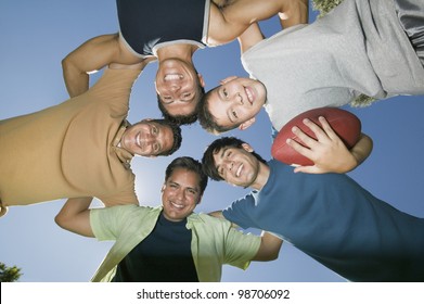 Men In A Football Huddle