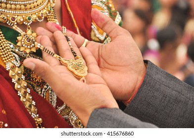 A Men Hand Showing His Bride Manglshutra   - Shutterstock ID 415676860