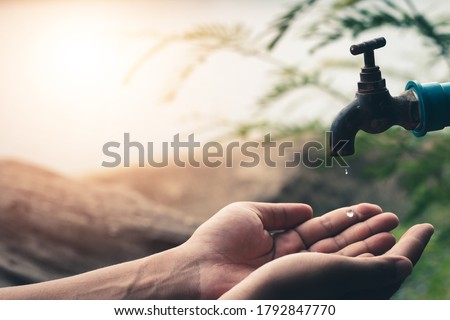 Men hand are waiting to drink water in the water shortage.