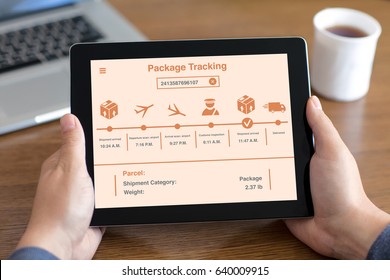 men hands holding tablet with app package tracking on screen