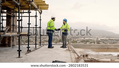 Men, handshake and tablet on construction site for agreement, development deal or welcome. Engineer, space and team shaking hands with tech for partnership and renovation collaboration at scaffolding